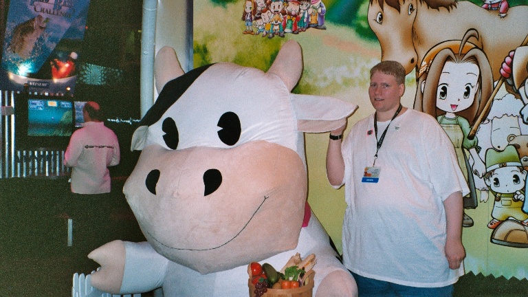 E3 2003. Posing with the cow from Harvest Moon at Natsume's booth