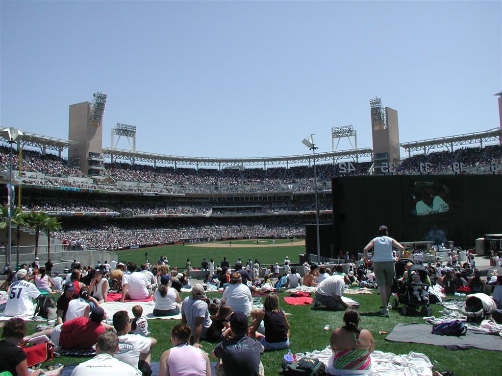 People chilling out behind the outfield wall at Petco.