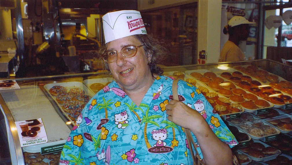 My mom came to visit us in Lansing in June 2004. Snapped this picture of her at Krispy Kreme. The hat, the doughnuts, the Hello Kitty shirt... it's the perfect photo.