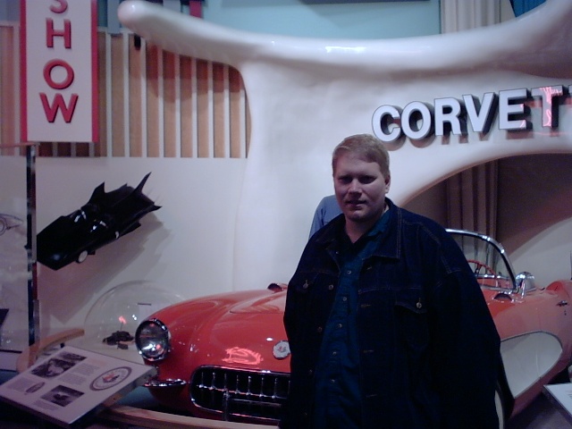 Frank poses in front of the 'vette, but perhaps the Batmobile on the left is the real subject